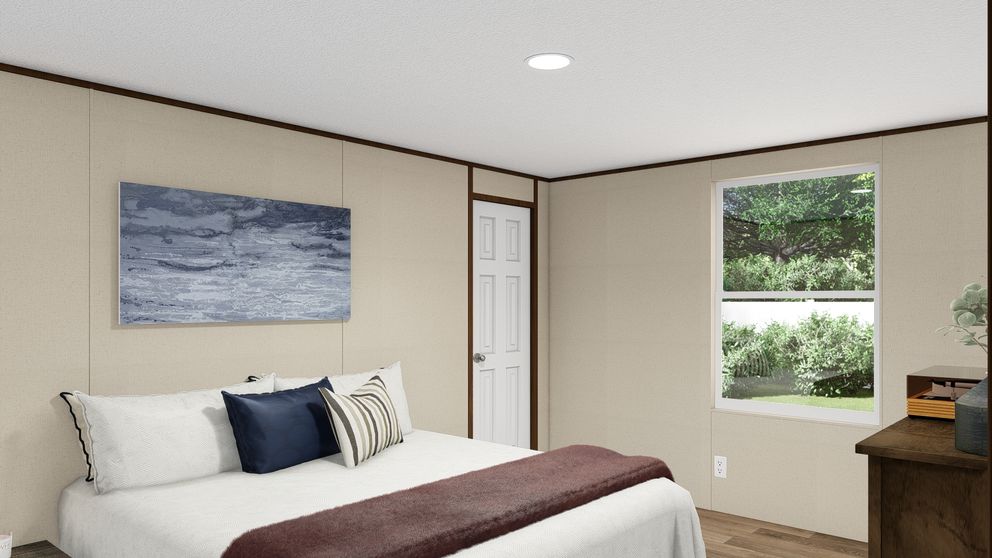 The THRILL Primary Bedroom. This Manufactured Mobile Home features 3 bedrooms and 2 baths.