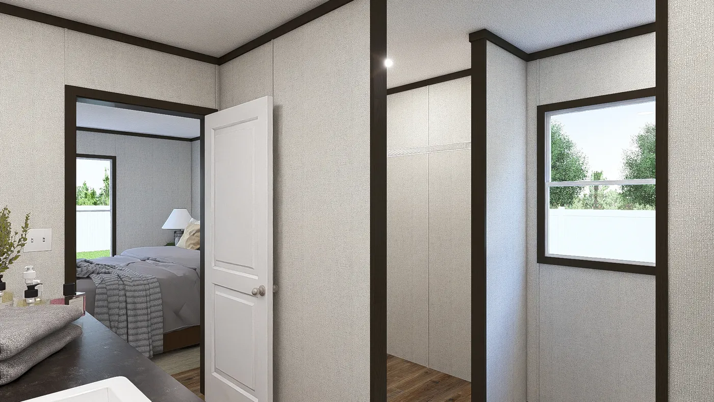 The OCCASSION Primary Bathroom. This Manufactured Mobile Home features 4 bedrooms and 2 baths.