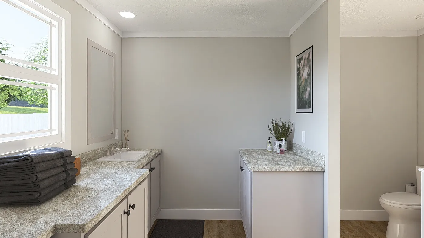 The THE BREEZE 64 Primary Bathroom. This Manufactured Mobile Home features 4 bedrooms and 2 baths.