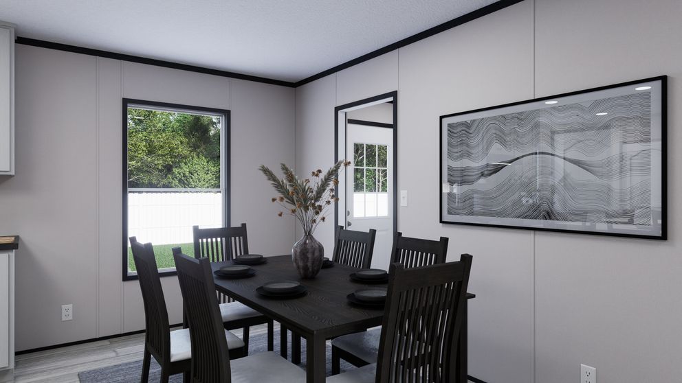 The THE MOUNTAINEER 56 Dining Area. This Manufactured Mobile Home features 3 bedrooms and 2 baths.