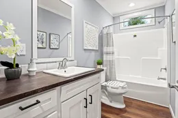 The THE OCEANSIDE Guest Bathroom. This Manufactured Mobile Home features 4 bedrooms and 3 baths.