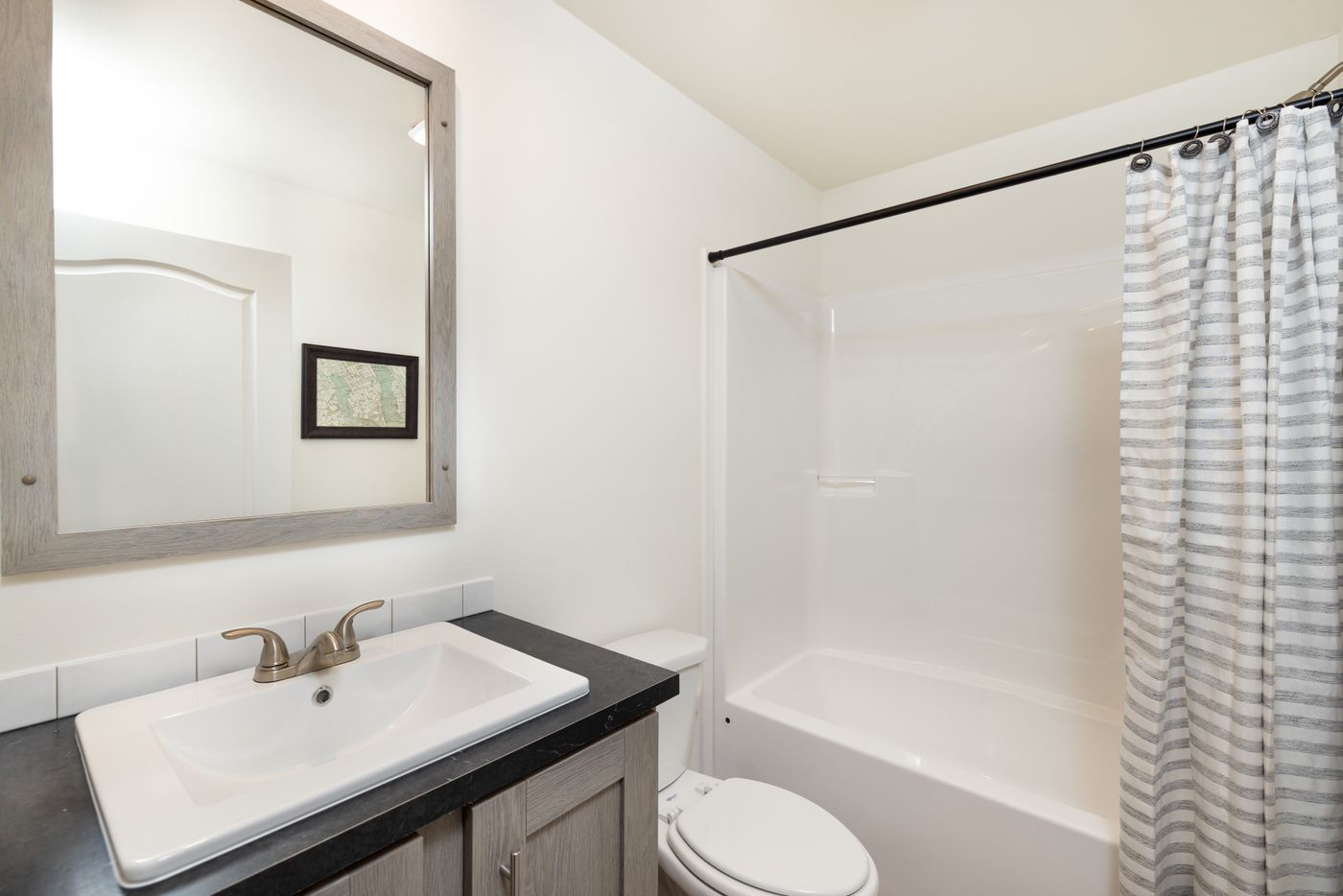 The RAMSEY 216-2 Guest Bathroom. This Manufactured Mobile Home features 3 bedrooms and 2 baths.