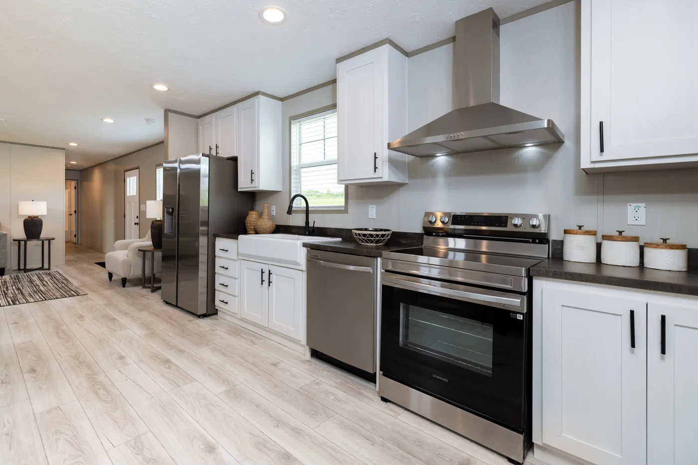 The SHOWER HOUSE Kitchen. This Manufactured Mobile Home features 3 bedrooms and 2 baths.