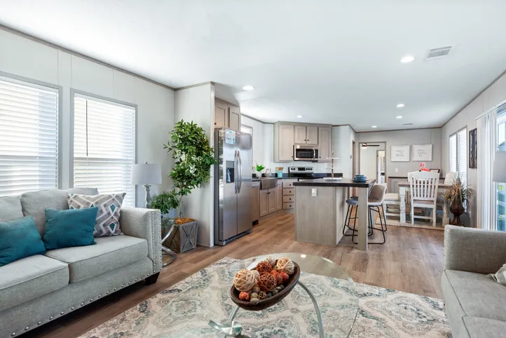 The RESOLUTION 16763J Living Room. This Manufactured Mobile Home features 3 bedrooms and 2 baths.