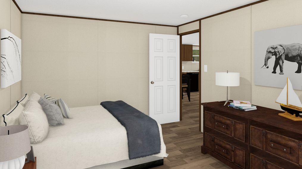 The SATISFACTION Guest Bedroom. This Manufactured Mobile Home features 3 bedrooms and 2 baths.