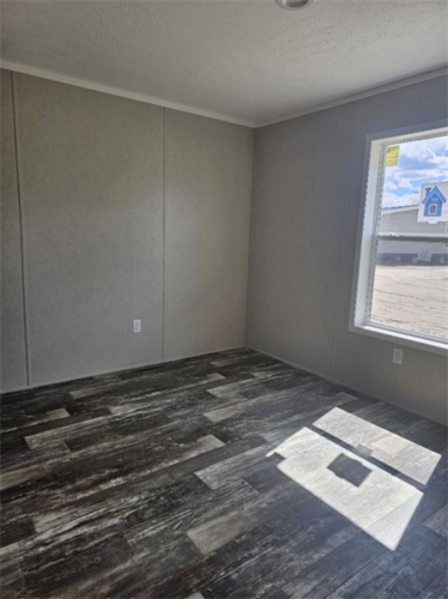 The TOPAZ Bedroom. This Manufactured Mobile Home features 3 bedrooms and 2 baths.