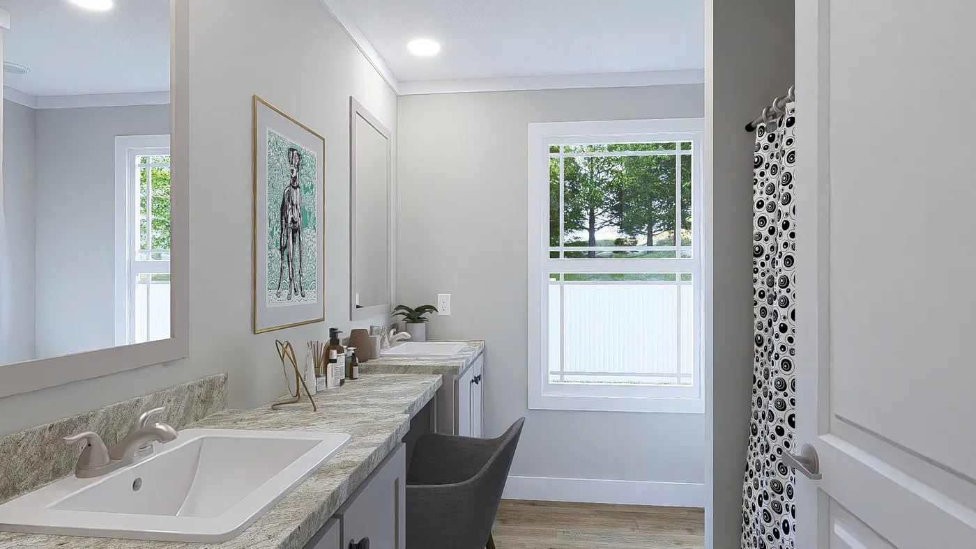 The THE BREEZE 64 Guest Bathroom. This Manufactured Mobile Home features 4 bedrooms and 2 baths.
