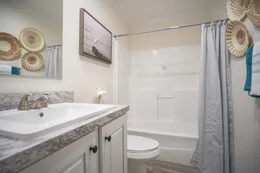 The 777-2 "COOL BREEZE" 7616 Guest Bathroom. This Manufactured Mobile Home features 3 bedrooms and 2 baths.