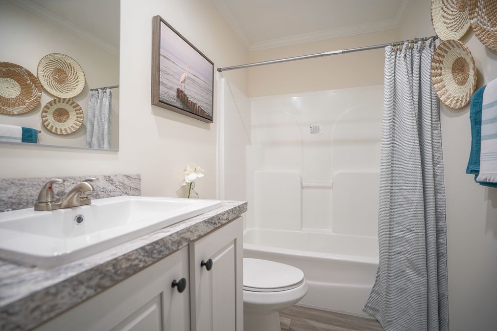 The 777-2 "COOL BREEZE" 7616 Guest Bathroom. This Manufactured Mobile Home features 3 bedrooms and 2 baths.
