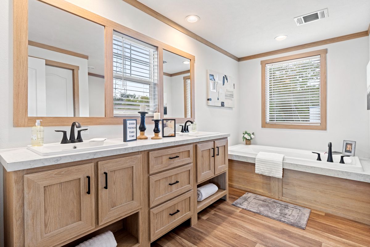 The THATCHER Primary Bathroom. This Manufactured Mobile Home features 4 bedrooms and 2 baths.