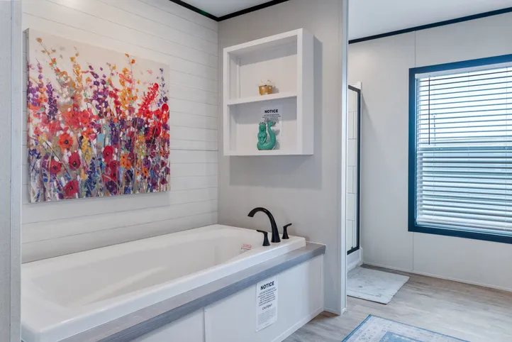 The HERCULES Primary Bathroom. This Manufactured Mobile Home features 4 bedrooms and 2 baths.
