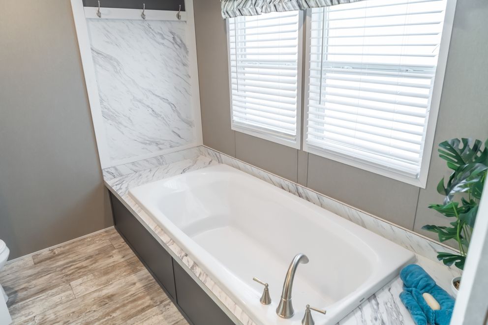 The MAJOR Primary Bathroom. This Manufactured Mobile Home features 3 bedrooms and 2 baths.