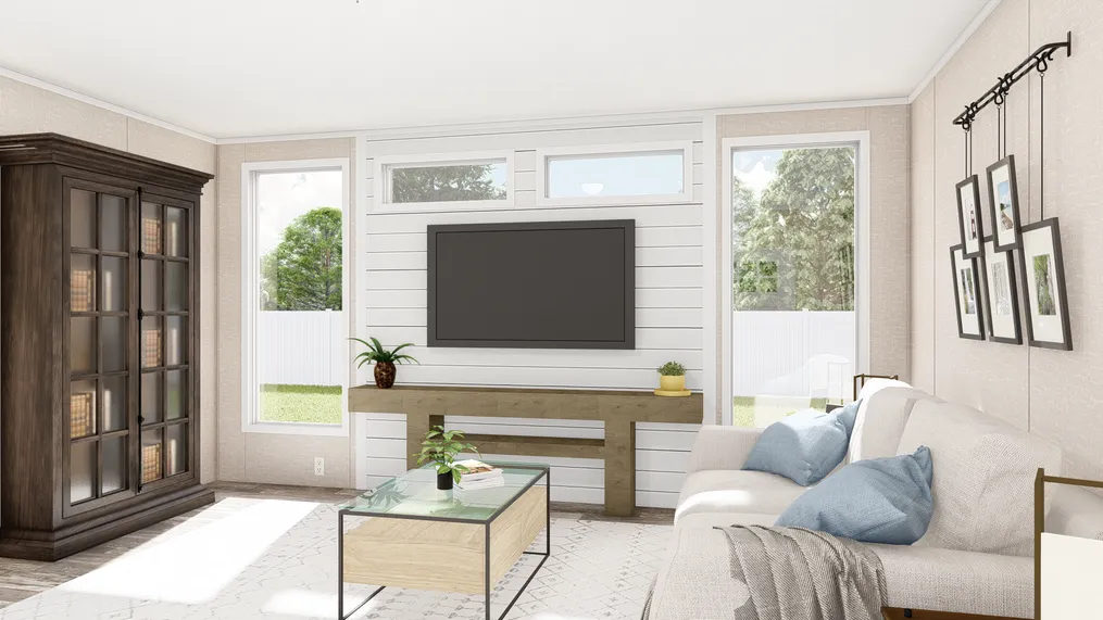 The THE ANNIVERSARY PLUS Living Room. This Manufactured Mobile Home features 3 bedrooms and 2 baths.