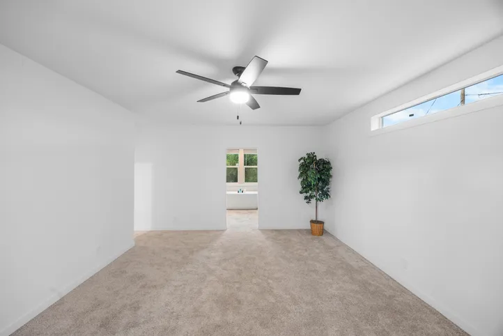 The LULAMAE 3 Primary Bedroom. This Manufactured Mobile Home features 3 bedrooms and 2 baths.