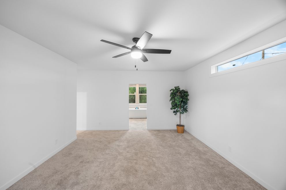 The LULAMAE 3 Primary Bedroom. This Manufactured Mobile Home features 3 bedrooms and 2 baths.