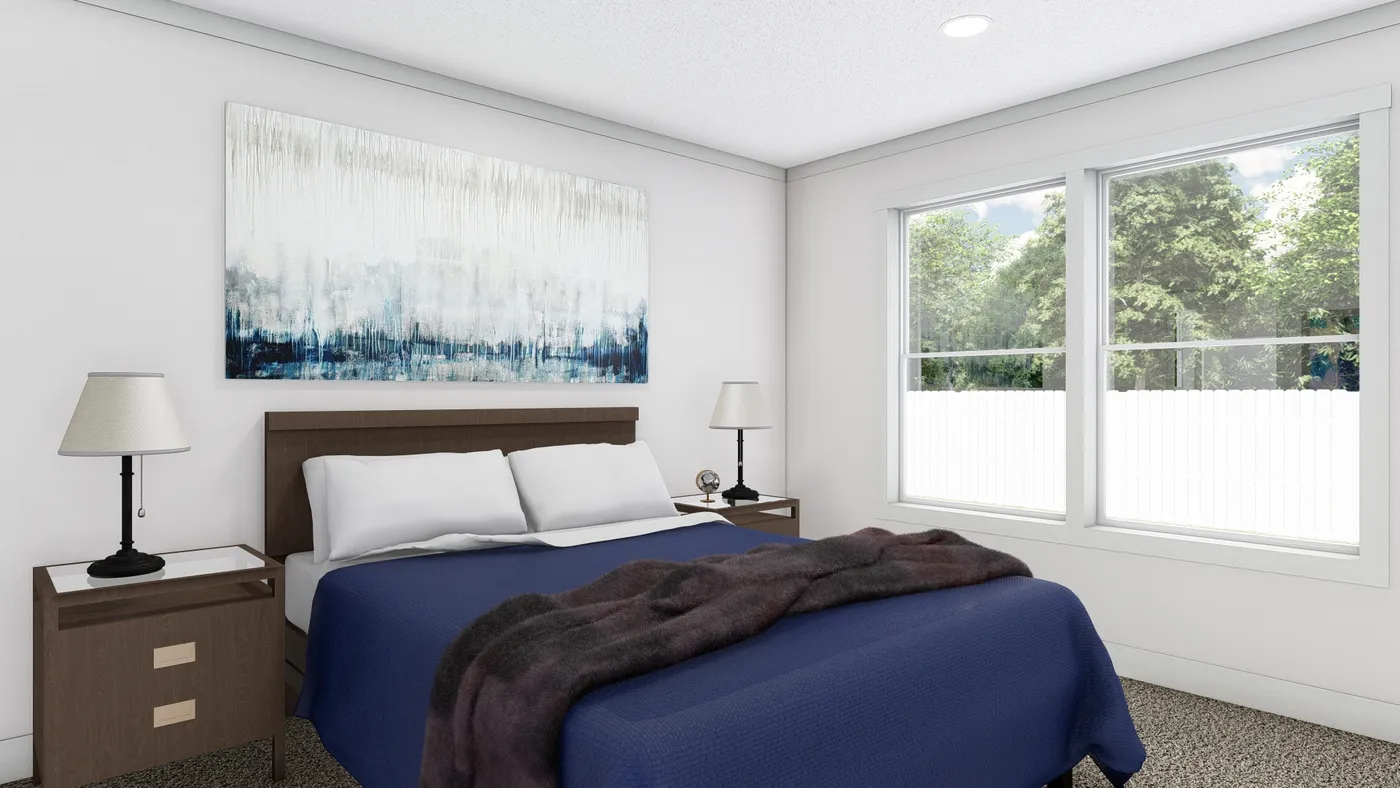 The JOHNNY B GOODE Primary Bedroom. This Manufactured Mobile Home features 3 bedrooms and 2 baths.