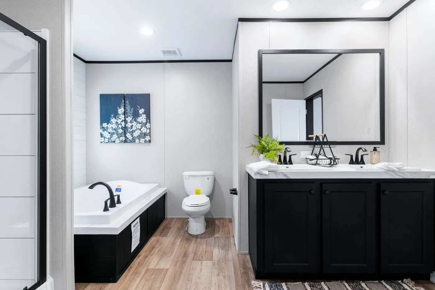 The ABSOLUTE VALUE Primary Bathroom. This Manufactured Mobile Home features 4 bedrooms and 2 baths.