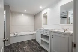 The ALL AMERICAN Primary Bathroom. This Manufactured Mobile Home features 3 bedrooms and 2 baths.