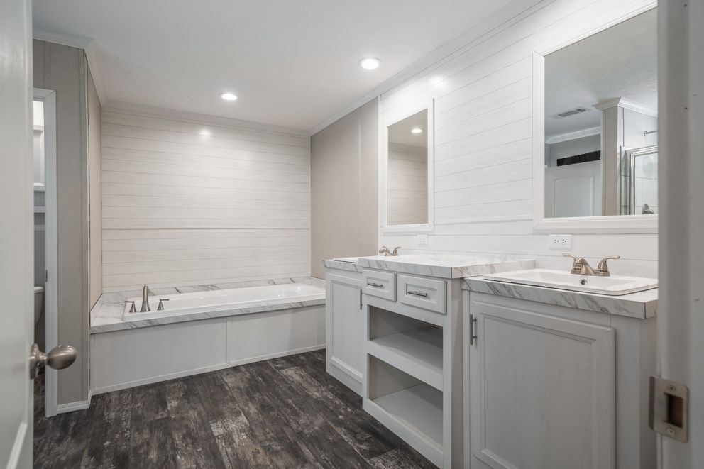 The ALL AMERICAN Primary Bathroom. This Manufactured Mobile Home features 3 bedrooms and 2 baths.