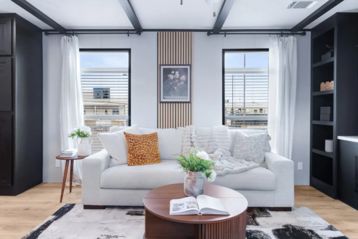 The ANNIVERSARY 16763S Living Room. This Manufactured Mobile Home features 3 bedrooms and 2 baths.