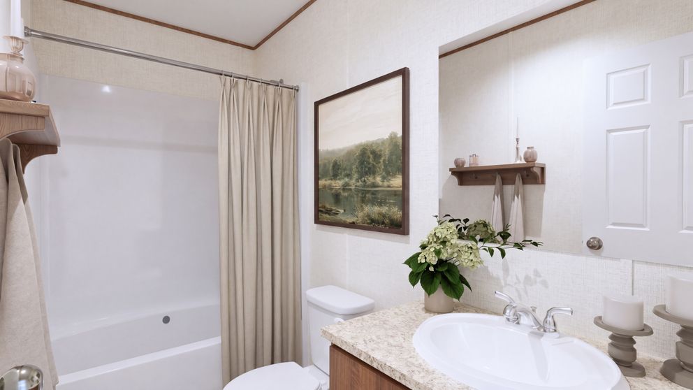 The ELM Primary Bathroom. This Manufactured Mobile Home features 2 bedrooms and 1 bath.