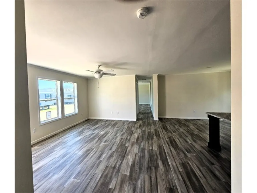 The SPINEL 64 Living Room. This Manufactured Mobile Home features 3 bedrooms and 2 baths.