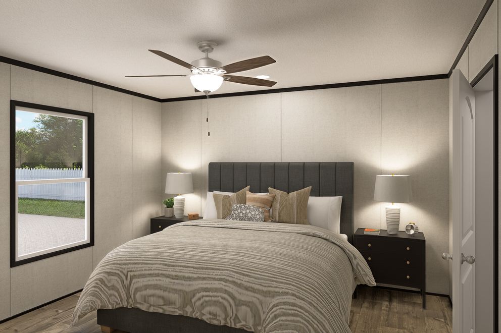 The THE MOUNTAINEER 48 Primary Bedroom. This Manufactured Mobile Home features 3 bedrooms and 2 baths.