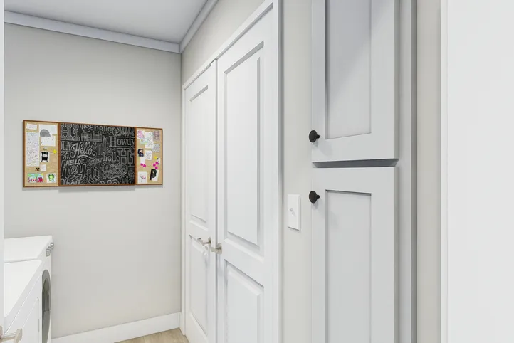 The CLASSIC 56D Utility Room. This Manufactured Mobile Home features 3 bedrooms and 2 baths.