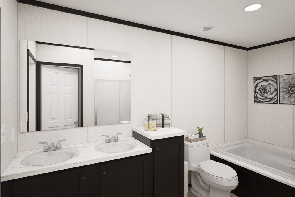 The PLATINUM ANNIVERSARY Exterior. This Manufactured Mobile Home features 3 bedrooms and 2 baths.
