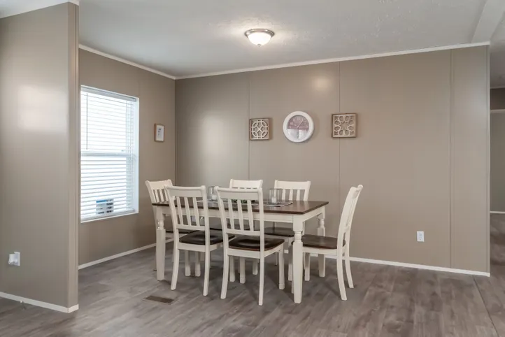 The ISLAND BREEZE Dining Room. This Manufactured Mobile Home features 3 bedrooms and 2 baths.