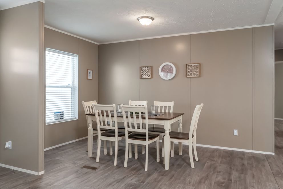 The ISLAND BREEZE Dining Room. This Manufactured Mobile Home features 3 bedrooms and 2 baths.