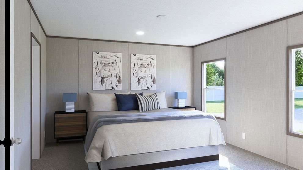 The ULTRA BREEZE 28X76 Primary Bedroom. This Manufactured Mobile Home features 4 bedrooms and 2 baths.