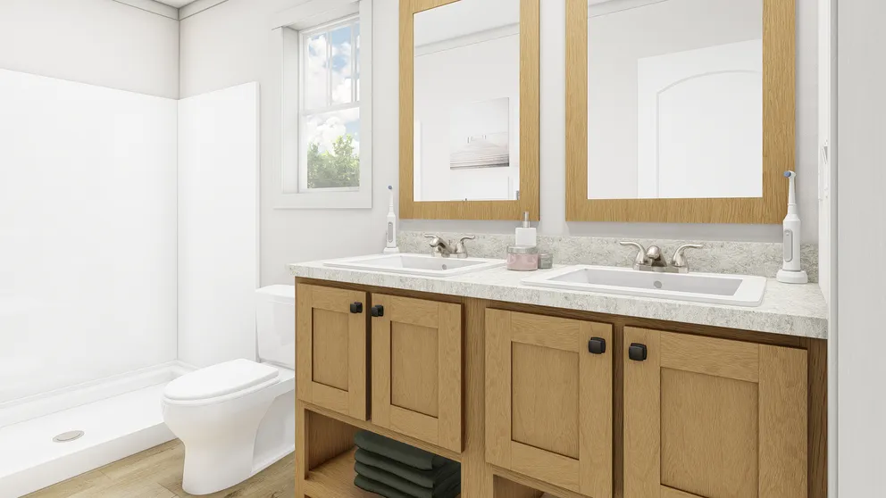 The STAND BY ME Primary Bathroom. This Manufactured Mobile Home features 3 bedrooms and 2 baths.