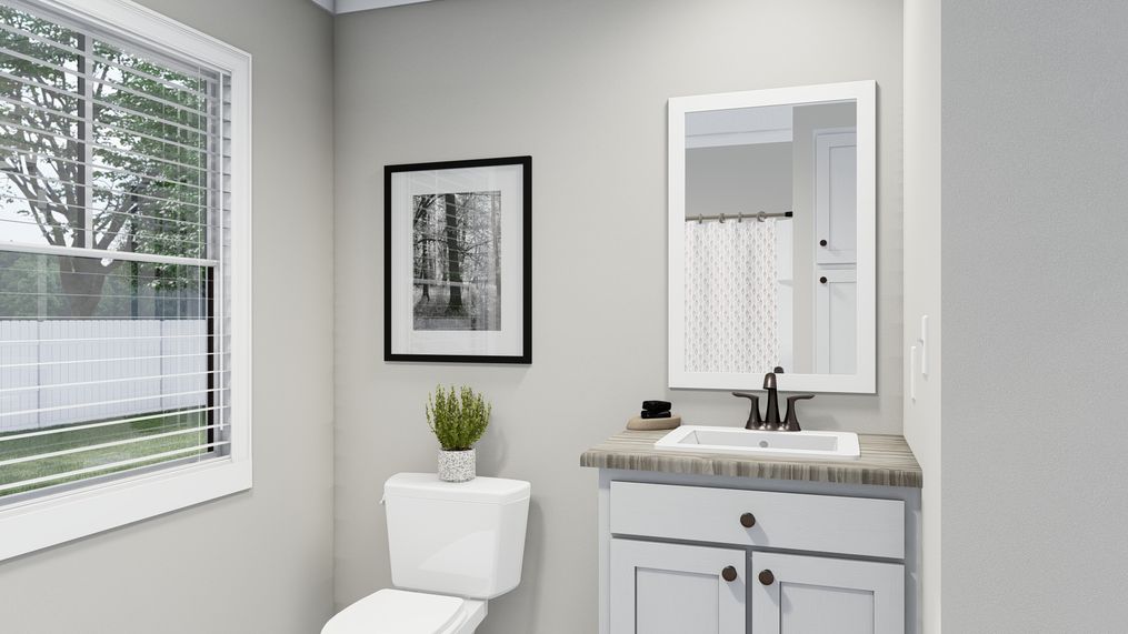 The THE FRANKLIN Guest Bathroom. This Manufactured Mobile Home features 3 bedrooms and 2 baths.