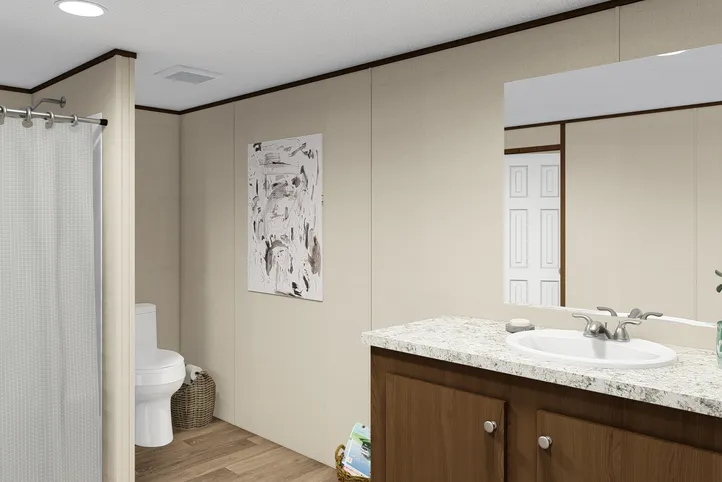 The THRILL Guest Bathroom. This Manufactured Mobile Home features 3 bedrooms and 2 baths.