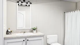 The THE FUSION 32H Guest Bathroom. This Manufactured Mobile Home features 5 bedrooms and 3 baths.