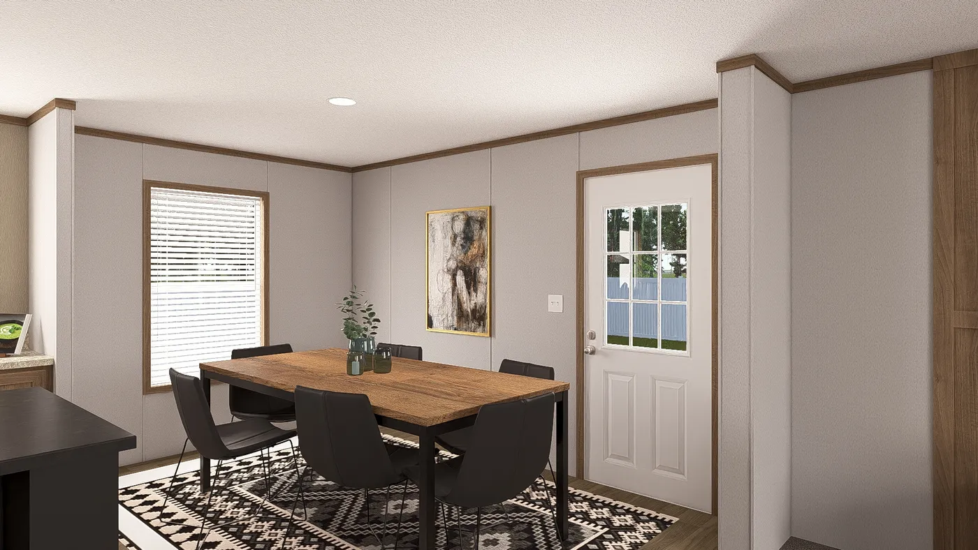 The THE RESERVE 52 Dining Area. This Manufactured Mobile Home features 3 bedrooms and 2 baths.