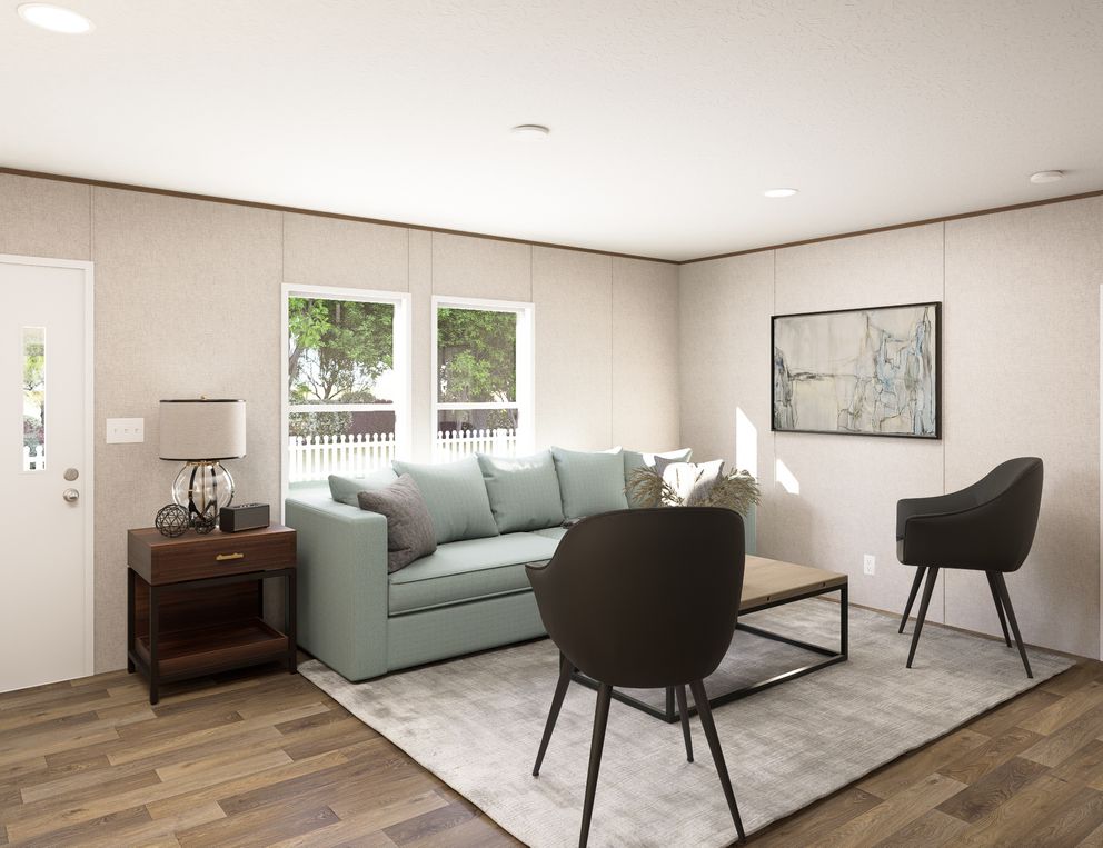 The OAK Living Room. This Manufactured Mobile Home features 4 bedrooms and 2 baths.