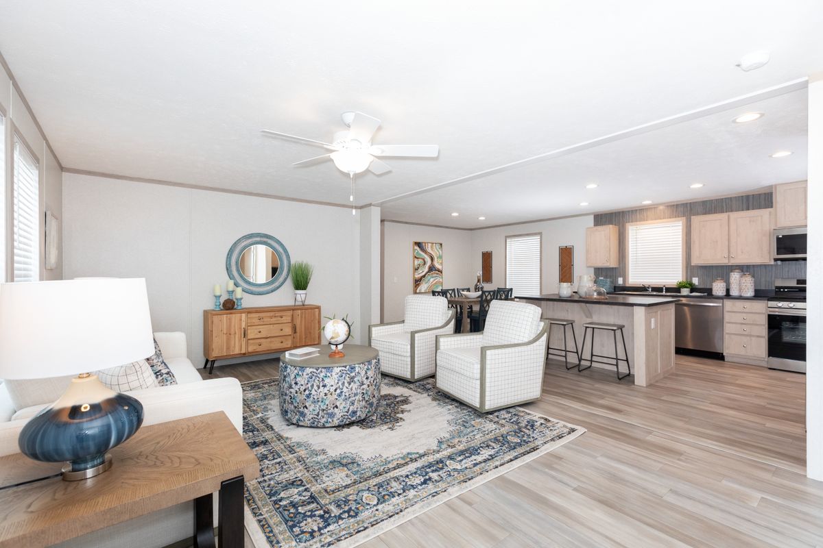 The 5628-5202 ADRENALINE Living Room. This Manufactured Mobile Home features 3 bedrooms and 2 baths.
