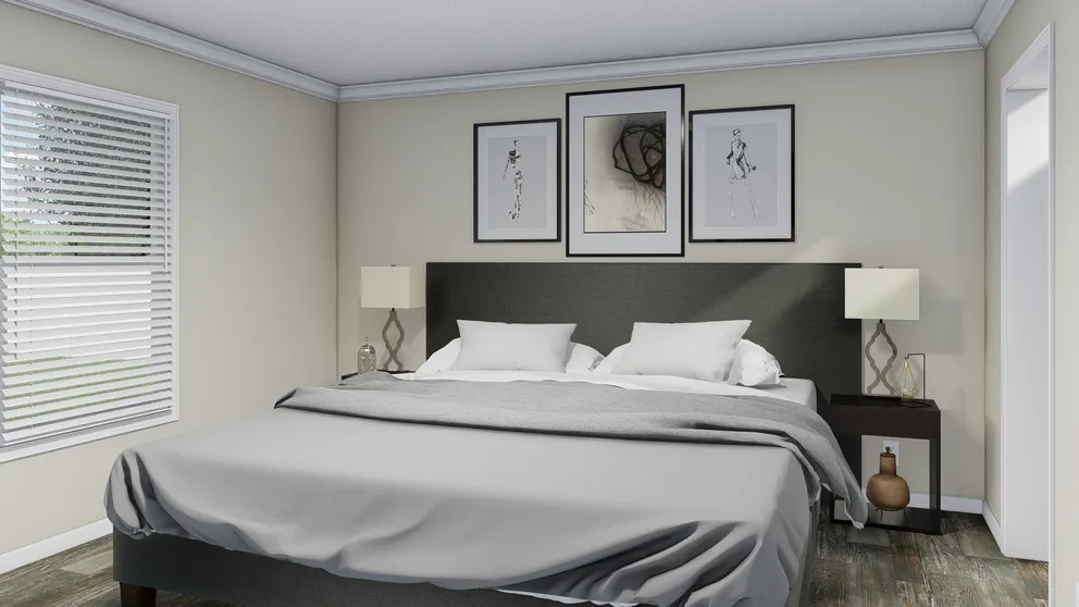 The CAROLINIAN M5010 Primary Bedroom. This Manufactured Mobile Home features 3 bedrooms and 2 baths.