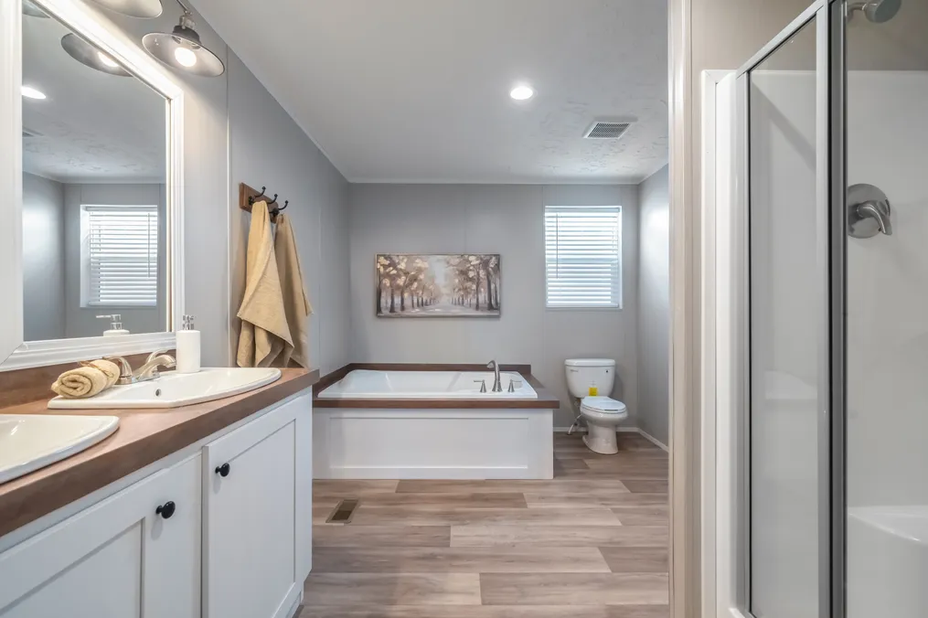 The TRADITION 2868B Primary Bathroom. This Manufactured Mobile Home features 4 bedrooms and 2 baths.