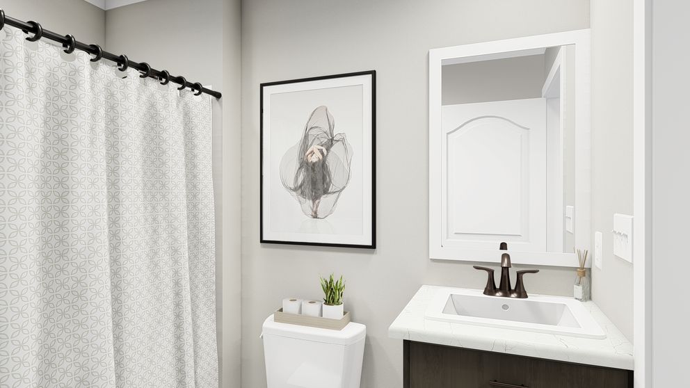 The THE ALEXANDER Guest Bathroom. This Manufactured Mobile Home features 3 bedrooms and 2 baths.