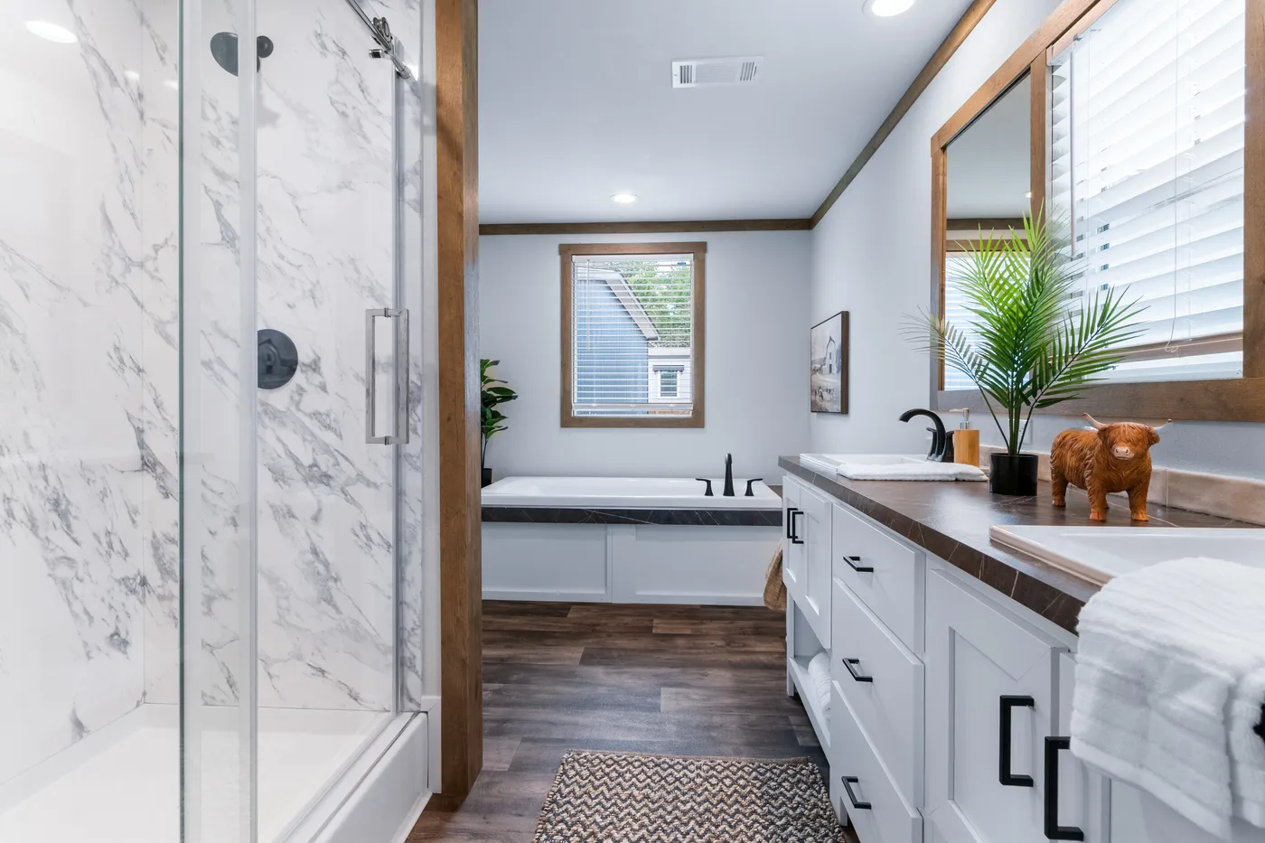 The SAWYER ELITE Primary Bathroom. This Manufactured Mobile Home features 3 bedrooms and 2 baths.