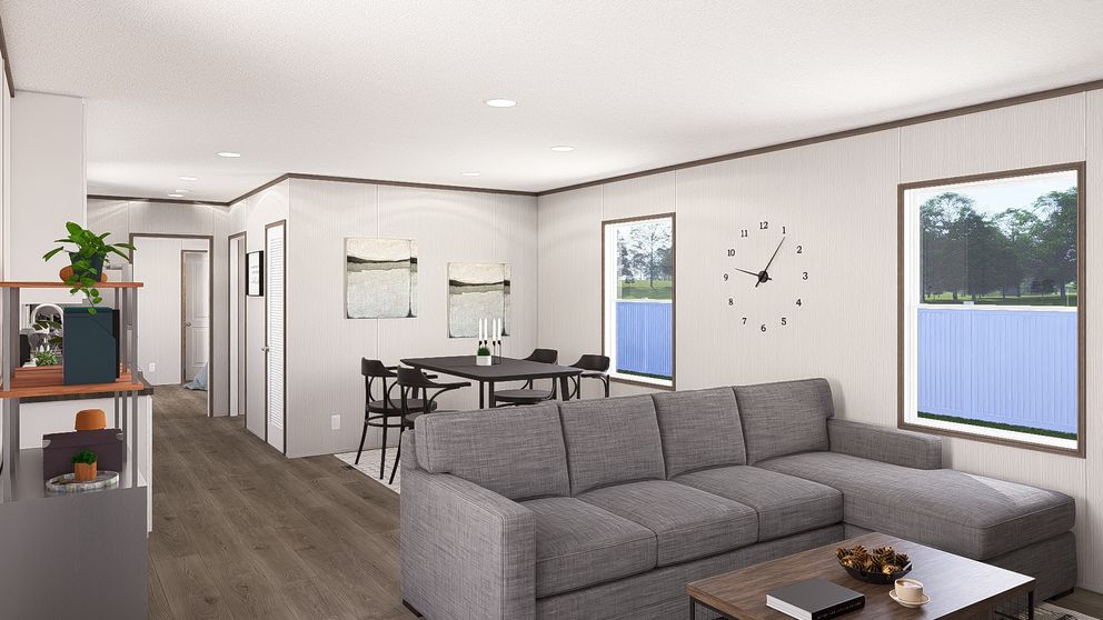 The LEGEND ANNIVERSARY 16X76 Living Room. This Manufactured Mobile Home features 3 bedrooms and 2 baths.