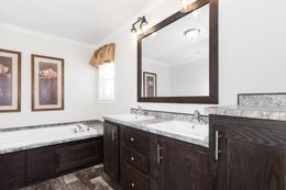 The CASTLE PINES Primary Bathroom. This Manufactured Mobile Home features 3 bedrooms and 2 baths.