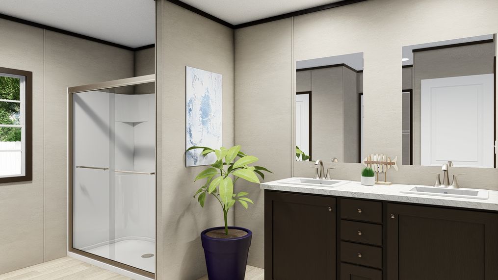 The ULTRA BREEZE 28X76 Primary Bathroom. This Manufactured Mobile Home features 4 bedrooms and 3 baths.