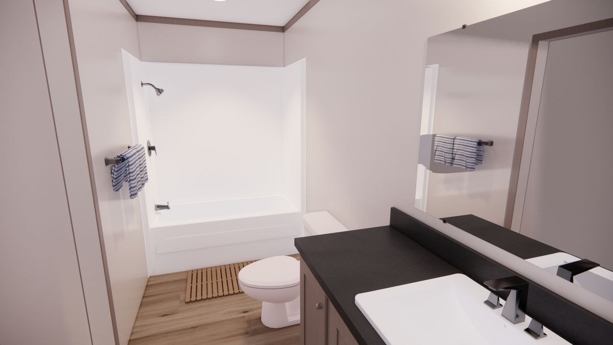 The 4828-E201 ADRENALINE Primary Bathroom. This Manufactured Mobile Home features 3 bedrooms and 2 baths.