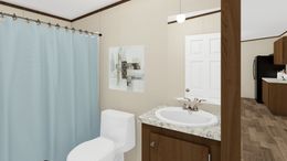The SATISFACTION Guest Bathroom. This Manufactured Mobile Home features 3 bedrooms and 2 baths.