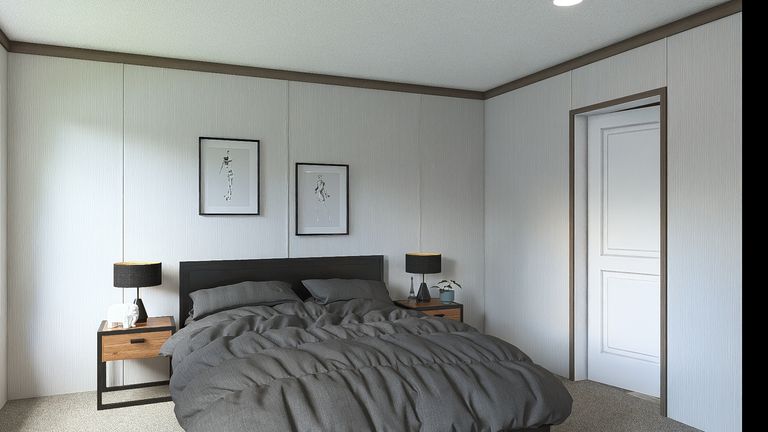 The ULTRA ISLAND BREEZE 56' Primary Bedroom. This Manufactured Mobile Home features 3 bedrooms and 2 baths.