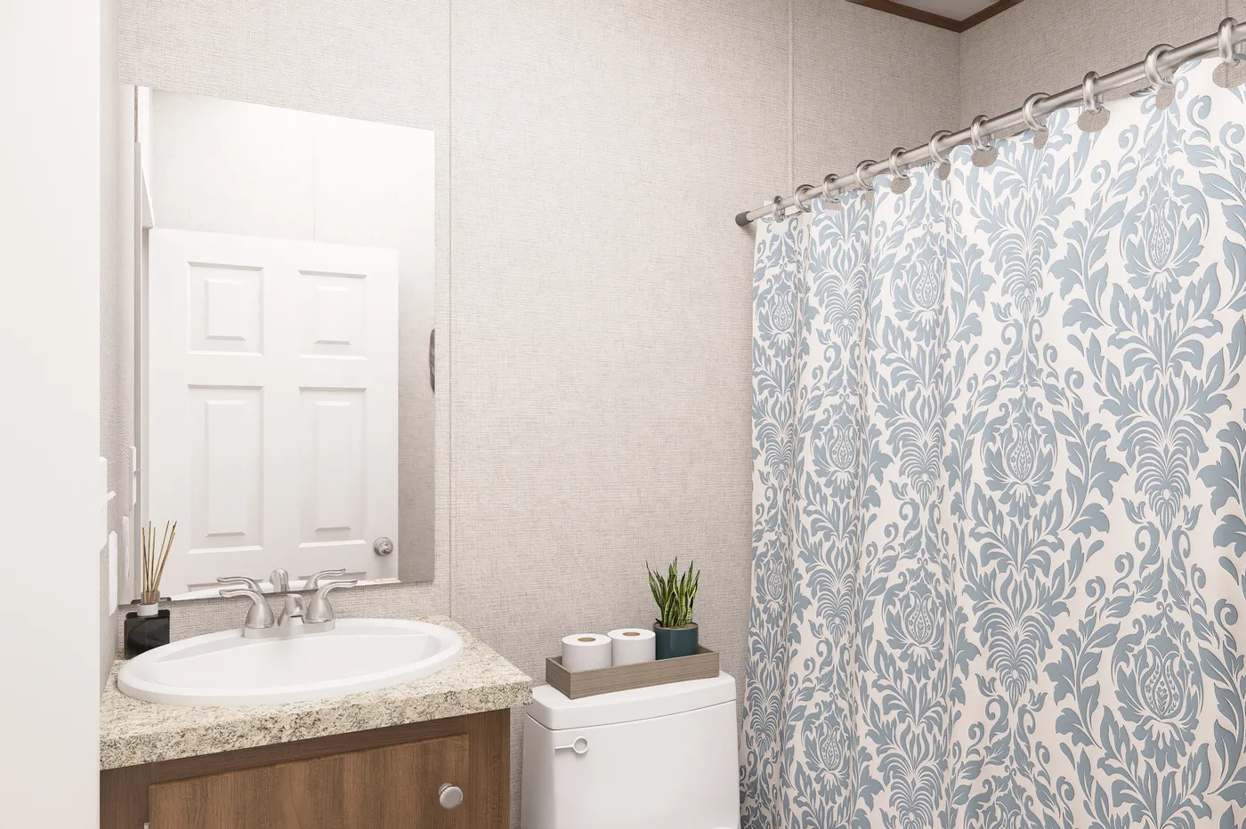 The HICKORY Guest Bathroom. This Manufactured Mobile Home features 3 bedrooms and 2 baths.